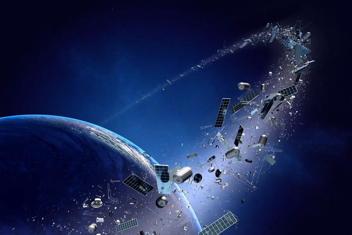 An illustration of broken satellite pieces and debris orbiting Earth