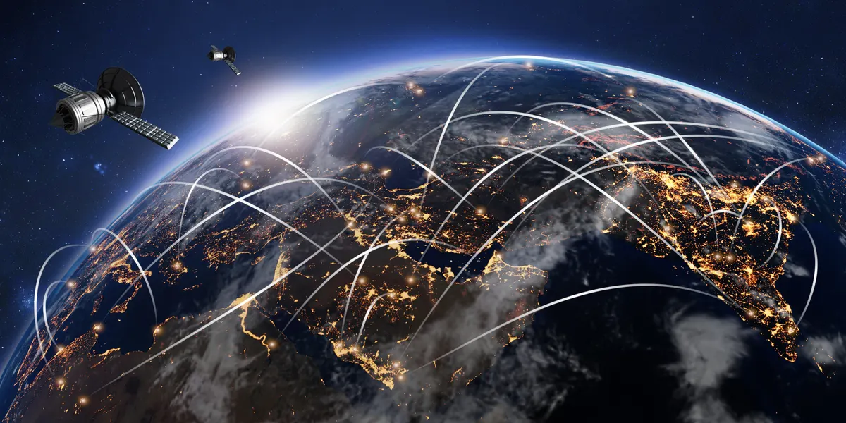 An illustration of satellites orbiting Earth with arcs of light linking points on the planet