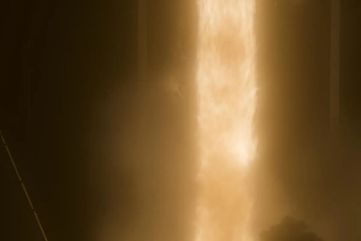 A long-exposure photo of a Falcon 9 rocket leaving a bright streak above Launch Complex 39A