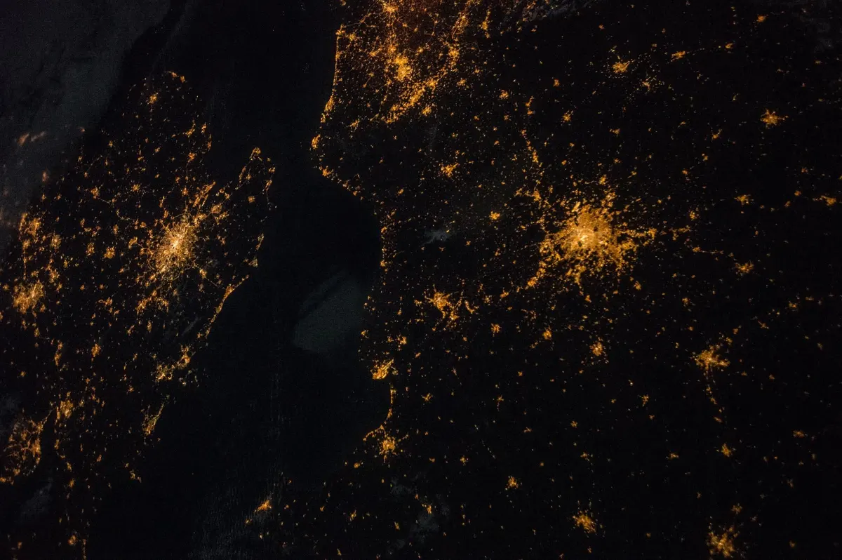City lights of the south of England and northern France seen from orbit at night